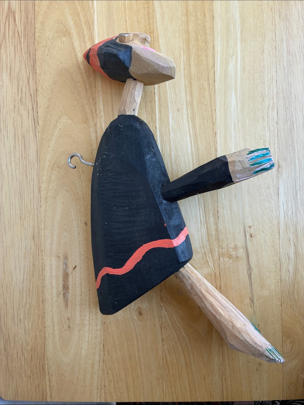 Strange hand carved folk art character with bland and orange clothes and a hook - Picture 2 of 13